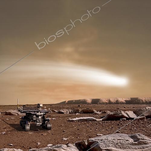 Biosphoto | 2483337 | An artist's depiction of the close pass of comet C/2013 A1 over the Martian landscape. Also known as comet Siding Spring, which is the Australian observatory that discovered the object, it is scheduled to pass by Mars in October of 2014. Rover image courtesy of NASA. | &copy; Marc Ward / Stocktrek Images / Biosphoto