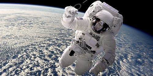 Biosphoto | 2483440 | Artist's concept of an astronaut floating in outer space. A cloud covered Earth is below. | &copy; Marc Ward / Stocktrek Images / Biosphoto
