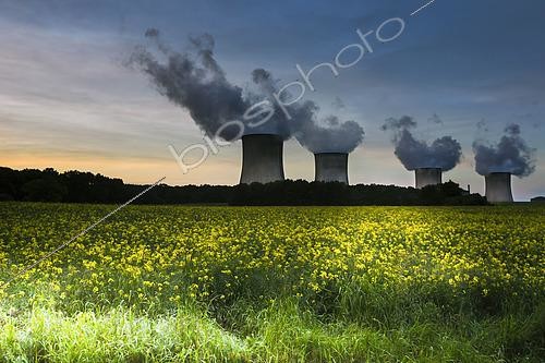 Biosphoto | 2575282 | Centrale nucléaire de Cattenom en Moselle avec quatre réacteurs en fonctionnement au coucher du soleil et champ de colza en fleurs, France | &copy; Claudius Thiriet / Biosphoto