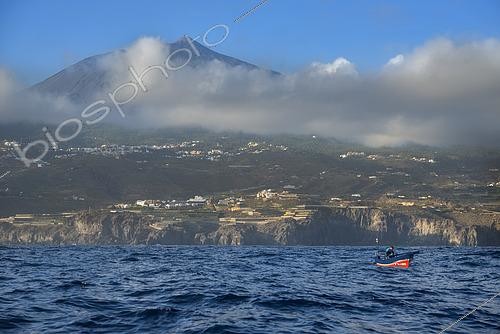 Biosphoto | 2609493 | Fisherman on the north coast of Tenerife, Teide volcano in the background. Fishing sector. Shrimp fishing (Plesionika narval) is a professional and artisanal activity carried out from small boats. Traps are placed on the seabed at depths of between 50 and 150 meters, and some fish are caught there. It is practiced year-round, although catches are more abundant in summer. Production is mainly for local consumption. BOAT: El Terror de los Mares. FISHERMAN: Frisco. San Marcos Fishermen's Guild of Icod de los Vinos, Tenerife, Canary Islands. | &copy; Sergio Hanquet / Biosphoto