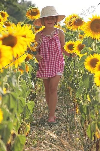 Biosphoto | 1925248 | Girl in a field of sunflowers in bloom - France  | &copy; Eric Guilloret / Biosphoto