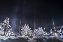 Biosphoto | 2418619 | Light pillars above Les Gets (Haute-Savoie). During the very cold night (-11 ° C) of December 13, 2018, the presence of crystals in suspension above Les Gets creates luminous pillars above the city. This phenomenon is not frequent in France. It occurs most often during extreme cold in medium and high mountains. It can be linked to natural freezing fog, snow cannons, or wood-burning emissions. | &copy; Christophe Suarez / Biosphoto