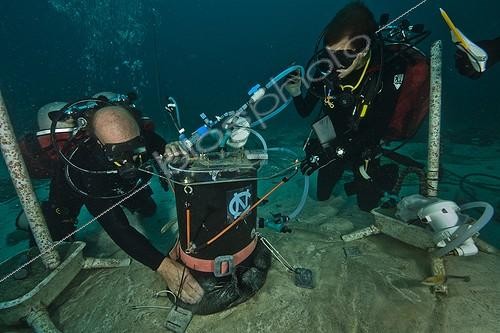 Biosphoto | 1934266 | Monitoring of sponge respiration - Aquarius Reef Bas Florida ; non-calcifying reef organisms like sponges will likely benefit from negative impacts to corals caused by ocean acidification and climate change; research data suggest that water passing through a filter feeding X muta sponge drops more than 0.01 pH units, a significant fraction of the 0.1 drop that has already resulted from the acidification of the ocean by the increase in atmospheric carbon dioxide in recent decades.; scientists try to understand how to distinguish local acidification processes, like that from sponge respiration, from the global scale changes now occurring around the world. Only in this decade have scientists fully realized the threat of global acidification to calcifying organisms such as corals. Marine scientists around the world are now attempting to provide the information that we need to both understand and manage this important problem; field work, experiments and scientific setups of the AUG 2011 Research Mission: Ocean Acidification: Controls on Reef pH; Principal Investigator: Dr. Chris Martens, UNC Chapel Hill<br>Co-Principal Investigator: Dr.Niels Lindquist (left), UNC Chapel Hill | &copy; Christoph Gerigk / Biosphoto