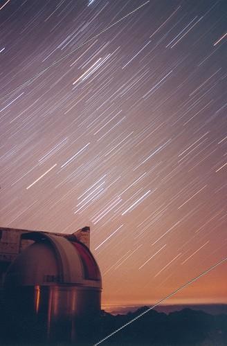 Biosphoto | 1255091 | Stars yarn above the Pic du Midi ; The stars of the constellation Orion leave contrails over one of the domes of the observatory of the Pic du Midi, including three parallel tracks of the Belt of Orion. Above is the Taurus. | &copy; Laurent Laveder / Biosphoto