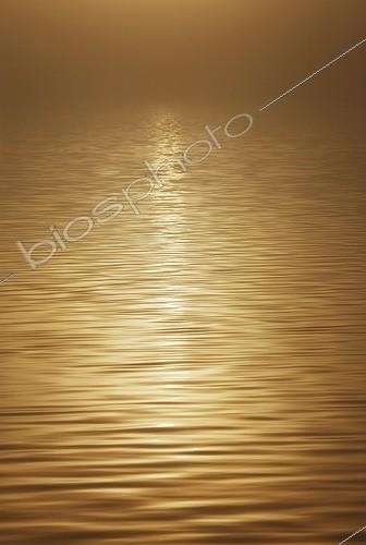 Biosphoto | 1607471 | Sunrise through the mist reflecting off the surface of Lake Laugarvatn, Iceland | &copy; Michael Peuckert / imageBROKER / Biosphoto