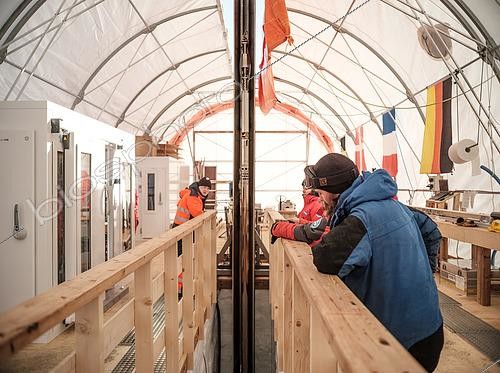 Biosphoto | 2593695 | The drilling team carefully observes the behavior of the corer, the device used to drill through the ice. Little Dome C, Antarctic Plateau, Antarctica | &copy; Armand Patoir / Biosphoto
