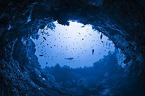 Biosphoto | 2526615 | Under the Hole, the door to the mesophotic zone, under an arch in natural light at a depth of 60 metres. Mayotte | &copy; Gabriel Barathieu / Biosphoto