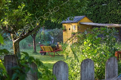 Biosphoto | 2084090 | Wheelbarrow and shed in vegetable garden, Provence, France | &copy; Philippe Giraud / Biosgarden / Biosphoto